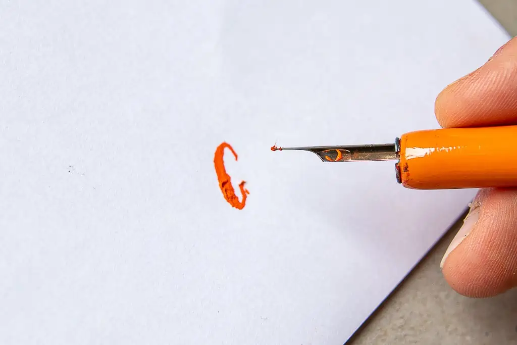 example of calligraphy nib catching onto the paper fibers. 