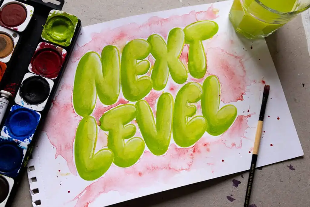 bubble letters made with green watercolors. 