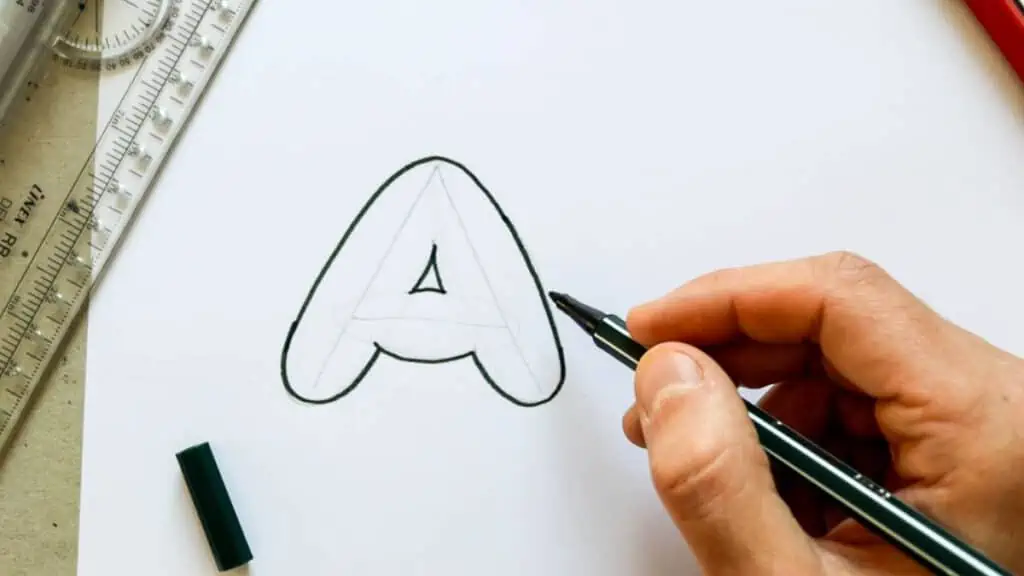 Bubble letter A outlined with black marker